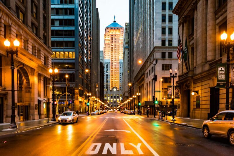 lighted roadway surrounded with buildings